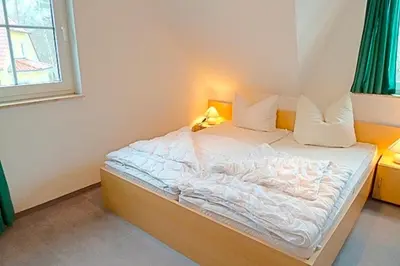 Ein Bett oder Betten in einem Zimmer der Unterkunft Am Deich 49