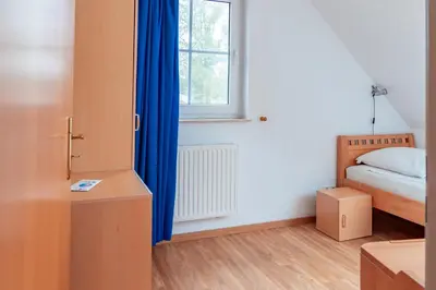 Ein Bett oder Betten in einem Zimmer der Unterkunft Am Deich 40
