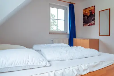 Ein Bett oder Betten in einem Zimmer der Unterkunft Am Deich 40