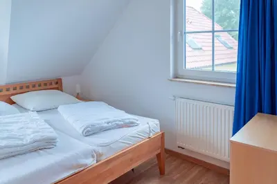 Ein Bett oder Betten in einem Zimmer der Unterkunft Am Deich 40