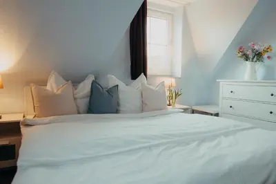 Ein Bett oder Betten in einem Zimmer der Unterkunft Am Deich 13