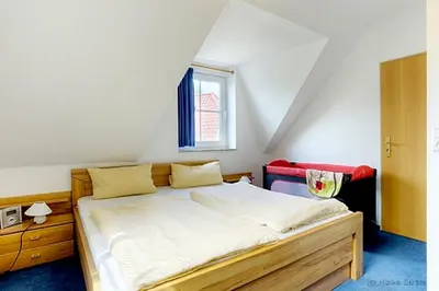 Ein Bett oder Betten in einem Zimmer der Unterkunft Am Deich 34
