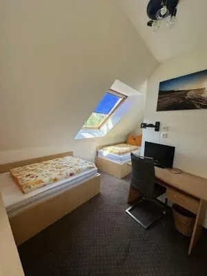 Ein Bett oder Betten in einem Zimmer der Unterkunft Am Deich 42