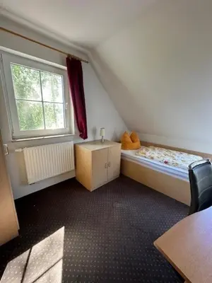 Ein Bett oder Betten in einem Zimmer der Unterkunft Am Deich 42