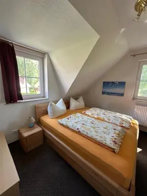 Ein Bett oder Betten in einem Zimmer der Unterkunft Am Deich 42