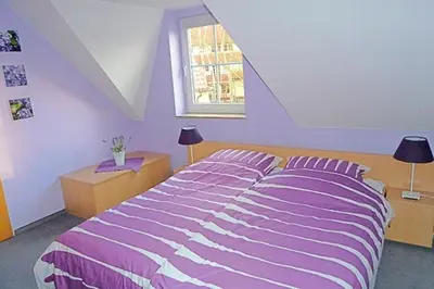 Ein Bett oder Betten in einem Zimmer der Unterkunft Am Deich 44