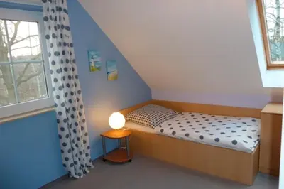 Ein Bett oder Betten in einem Zimmer der Unterkunft Am Deich 44