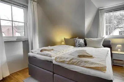 Ein Bett oder Betten in einem Zimmer der Unterkunft Am Deich 43
