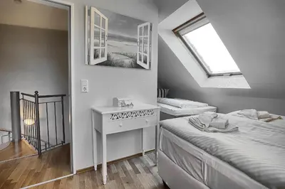 Ein Bett oder Betten in einem Zimmer der Unterkunft Am Deich 43