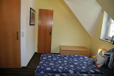 Ein Bett oder Betten in einem Zimmer der Unterkunft Am Deich 23 Strandeule Zingst