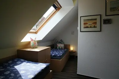 Ein Bett oder Betten in einem Zimmer der Unterkunft Am Deich 23 Strandeule Zingst