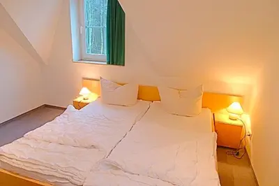 Ein Bett oder Betten in einem Zimmer der Unterkunft Am Deich 46