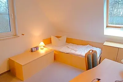 Ein Bett oder Betten in einem Zimmer der Unterkunft Am Deich 46
