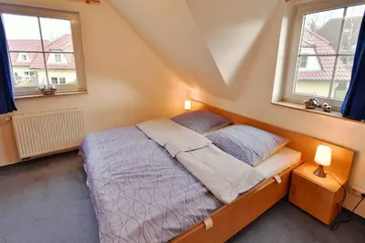 Ein Bett oder Betten in einem Zimmer der Unterkunft Am Deich 41