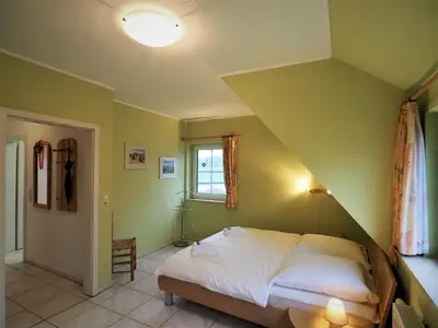 Ein Bett oder Betten in einem Zimmer der Unterkunft Mensendiek, Anita, FW