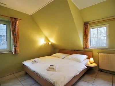 Ein Bett oder Betten in einem Zimmer der Unterkunft Mensendiek, Anita, FW