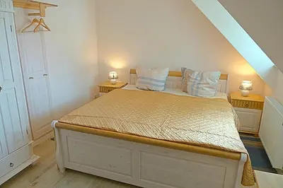 Ein Bett oder Betten in einem Zimmer der Unterkunft Les Belles, Haus Bastien, FW Noble, Whg 9