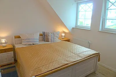 Ein Bett oder Betten in einem Zimmer der Unterkunft Les Belles, Haus Bastien, FW Noble, Whg 9