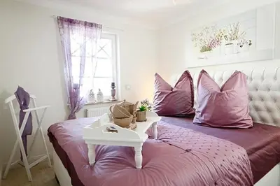 Ein Bett oder Betten in einem Zimmer der Unterkunft Les Belles, Haus Bastien, FW Galant, Whg 6