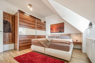 Ein Bett oder Betten in einem Zimmer der Unterkunft Les Belles, Haus Cecile, FW Romantique, Whg 5
