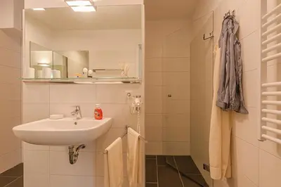 Ein Badezimmer in der Unterkunft Les Belles, Haus Davide, FW Exclusive, Whg 7