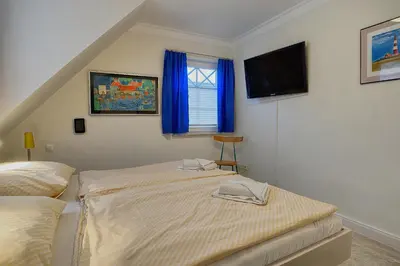 Ein Bett oder Betten in einem Zimmer der Unterkunft Les Belles, Haus Davide, FW Mondain, Whg 10