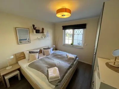 Ein Bett oder Betten in einem Zimmer der Unterkunft Villa Carpe Diem,Whg 1