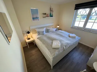 Ein Bett oder Betten in einem Zimmer der Unterkunft Villa Carpe Diem,Whg 1