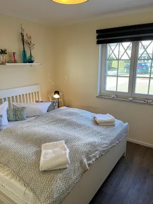 Ein Bett oder Betten in einem Zimmer der Unterkunft Villa Carpe Diem,Whg 1