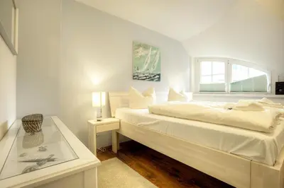 Ein Bett oder Betten in einem Zimmer der Unterkunft Haus Windflüchter