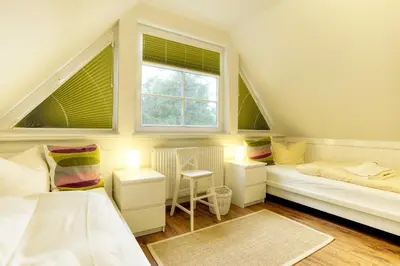 Ein Bett oder Betten in einem Zimmer der Unterkunft Haus Windflüchter