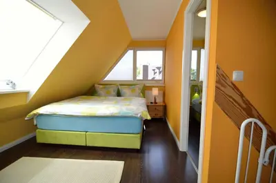 Ein Bett oder Betten in einem Zimmer der Unterkunft Ferienhaus Lütten Kulli - 1