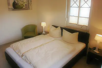 Ein Bett oder Betten in einem Zimmer der Unterkunft Villa Morgentied, FW 1