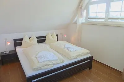 Ein Bett oder Betten in einem Zimmer der Unterkunft Villa Morgentied, FW 7