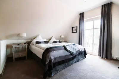 Ein Bett oder Betten in einem Zimmer der Unterkunft Apartmentanlage Seezeichen