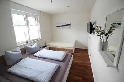 Ein Bett oder Betten in einem Zimmer der Unterkunft Strandlust V6W1