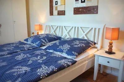 Ein Bett oder Betten in einem Zimmer der Unterkunft Strandhafer V4W2