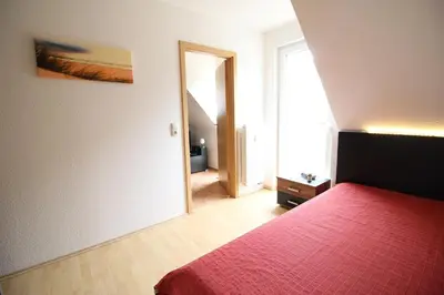 Ein Bett oder Betten in einem Zimmer der Unterkunft Strandperle App 10