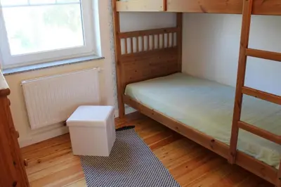 Ein Bett oder Betten in einem Zimmer der Unterkunft Strandvilla Sophie App 1