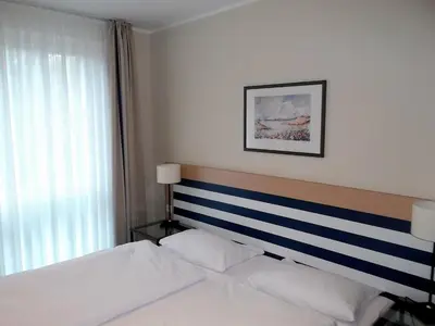 Ein Bett oder Betten in einem Zimmer der Unterkunft Möwe App 510