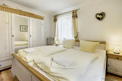 Ein Bett oder Betten in einem Zimmer der Unterkunft Villa Arielle, FW 4