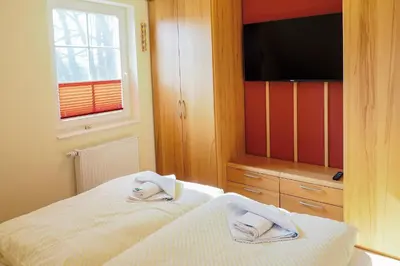 Ein Bett oder Betten in einem Zimmer der Unterkunft Villa Arielle, FW 5