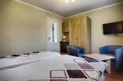 Ein Bett oder Betten in einem Zimmer der Unterkunft Barth, Dieter
