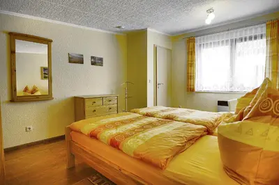 Ein Bett oder Betten in einem Zimmer der Unterkunft Barth, Dieter