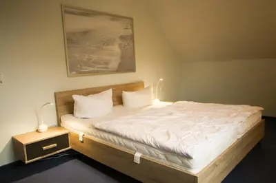Ein Bett oder Betten in einem Zimmer der Unterkunft Ostseevilla Dietlinde