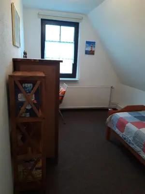 Ein Bett oder Betten in einem Zimmer der Unterkunft Lange Str. 15 - Ferienwohnung