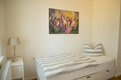 Ein Bett oder Betten in einem Zimmer der Unterkunft Grüne Hufe
