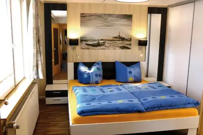 Ein Bett oder Betten in einem Zimmer der Unterkunft Achterdeck FW 2