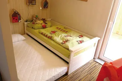 Ein Bett oder Betten in einem Zimmer der Unterkunft Achterdeck FW 2