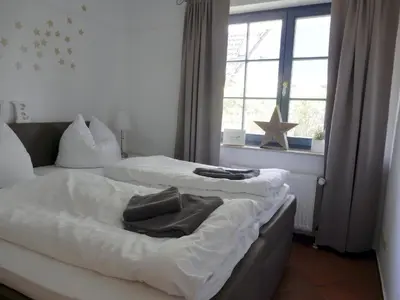 Ein Bett oder Betten in einem Zimmer der Unterkunft Eichenpark 32